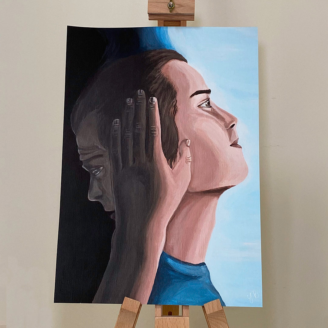 An A3 print shows two faces in profile, transitioning from shadow to light. On the left, the face is dark, with a sombre expression. A hand, also in shadow, gently rests on the side of their head. On the right, the same face appears in the light, looking upward with a peaceful, hopeful expression. The background transitions from dark on the left to bright, sky-blue on the right, symbolising a journey from darkness to light, or despair to hope. large wall canvas painting, low self value. Flutter to Bloom