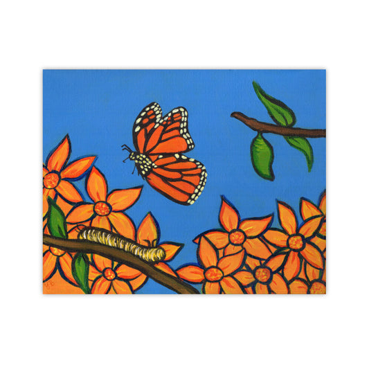 A colourful print on an easel of a painting that depicts a monarch butterfly in mid-flight against a bright blue sky. Below the butterfly, a yellow caterpillar crawls along a branch. The branch extends into vibrant orange flowers on the left and a green chrysalis hanging on the right. NZ Art Print, surreal, giclée . Flutter to Bloom
